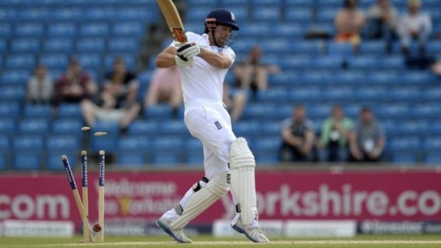 England's captain Alastair Cook is dismissed by Sri Lanka's Dhammika Prasad for 16.