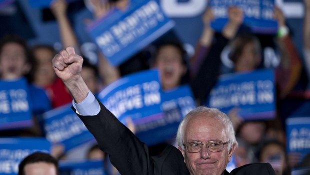 Senator Bernie Sanders salutes his supporters at a campaign rally this month.