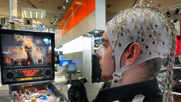 New mind-reading devices let CeBit attendees play pinball using only the power of their thoughts.