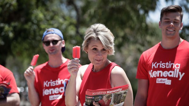 Labor candidate for Bennelong, Kristina Keneally has an icy pole while handing out how to vote cards at the Ryde East Public School polling booth.