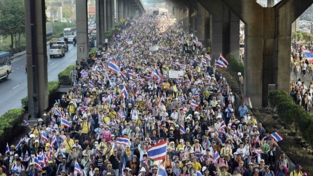 Anti-government protesters march during a rally in Bangkok.