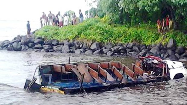 Wreckage: the remains of the bus that was swept into the flood water.