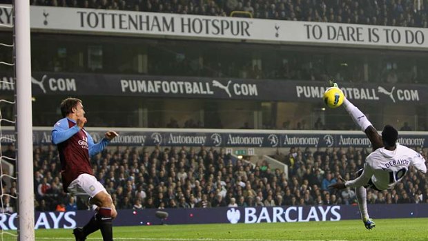 Emmanuel Adebayor of Spurs scores the opening goal against Aston Villa.