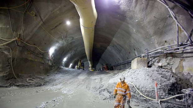 A worker stands in the Brisbane Airport Link tunnel.