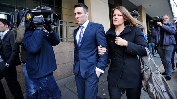 Stephen Milne leaves court with his wife, Melissa, on July 5.