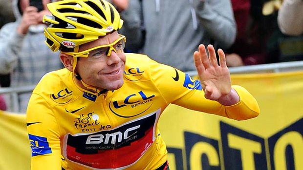 Thousands of fans greet Tour d' France winner Cadel Evans.
