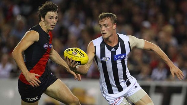 Much-loved teammate ... John McCarthy playing for Collingwood.