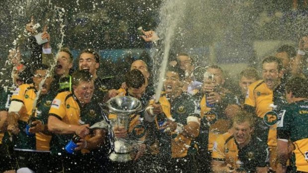 Champagne rugby: Northampton players celebrate their Challenge Cup triumph.