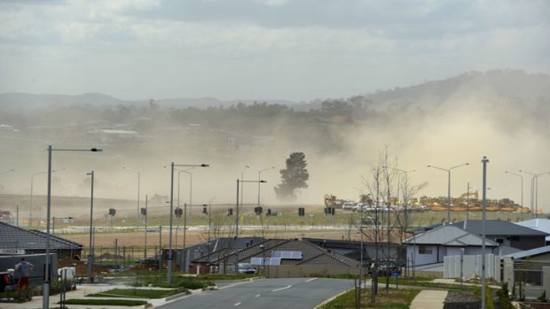 News. Gusty winds blow across the developing suburb of Coombs, making work an unpleasant task and showering the neighbouring suburbs with fine red dust.