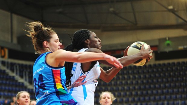 Canberra Capitals' Rosie Fadljevic and South East Queensland Stars' Ify Ibekne in action. 