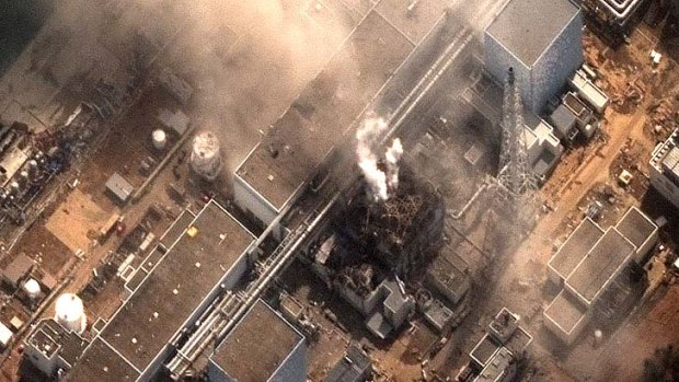 Risk of meltdown ... smoke comes out of the Fukushima Daiichi nuclear plant.