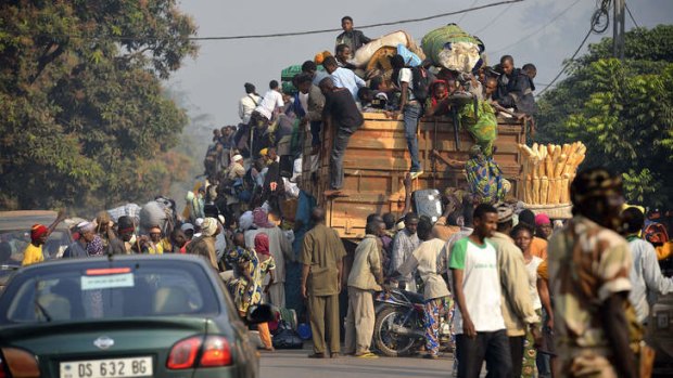Fleeing Bangui: People load their belongings onto a truck on the road to Chad.