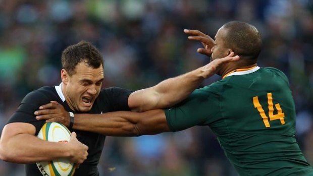 Blackout ... J.P. Pietersen grapples Israel Dagg, one of the few standouts for the All Blacks.