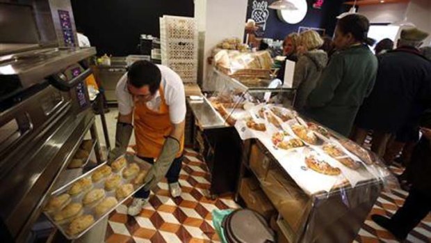 An employee at an outlet of bakery in Lisbon.