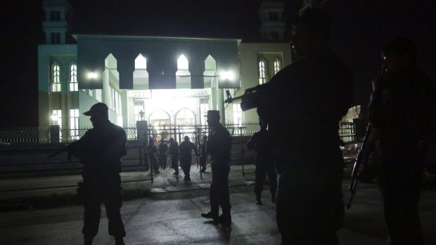Security forces respond at the site of a suicide attack on a Shiite mosque in Kabul, Afghanistan.