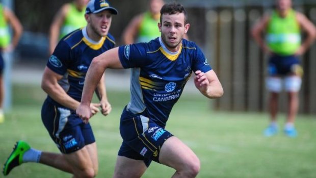 Robbie Coleman on the run at Brumbies training.