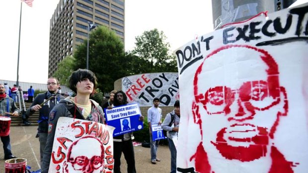 Protesters gather outside the building where Georgia Board of Pardons and Paroles.