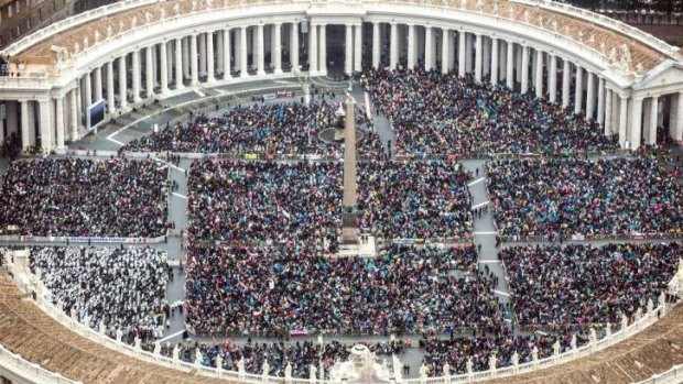 Crowds gather in St Peters Square in Vatican City.