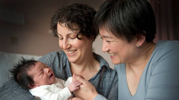 Penny Wong and partner Sophie Allouache after the birth of their daughter Alexandra in 2011. 