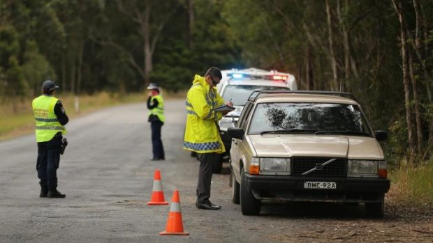 NSW Police stop and question motorists at a checkpoint on the outskirts of Kendall.