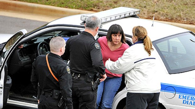 Professor Amy Bishop is taken into custody after the shootings at the University of Alabama in Huntsville.