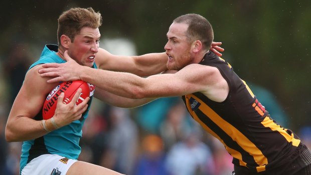 ADELAIDE, AUSTRALIA - MARCH 12: Jarryd Roughead of the Hawks tackles Brett Eddy of the Power during the JLT Community Series match between the Port Adelaide Power and the Hawthorn Hawks at Hickinbotham, Oval on March 12, 2017 in Adelaide, Australia. (Photo by Morne de Klerk/Getty Images)