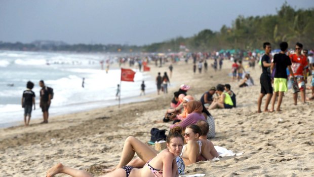Kuta beach, Bali. Australian visitors to Indonesia will continue to pay a $US35 fee for a visa upon entry.