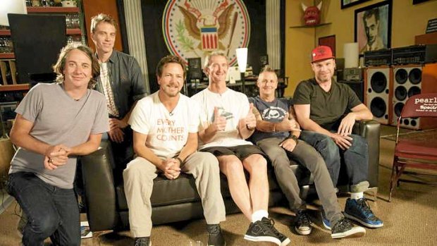 Aussie surfer Mark Richards (giving the thumbs up) with Pearl Jam.