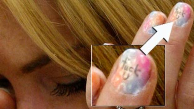 Sign of the times ... Lohan's painted nails tell their own story.