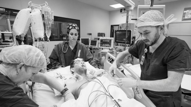 Theatre staff prepare Nick after liver transplant surgery before being transferred to the Intensive Care Unit. Supplied pix from Andrew Chapman August 2016? picture are for use only when promoting?www.donatelife.gov.au?