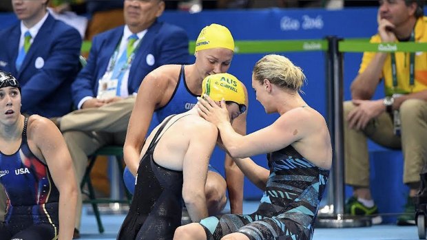 Superstar: Sarah Sjostrom (top) comforts Cate Campbell after her shock 100m freestyle final fourth place in Rio - now she has smashed the Australian's world record.