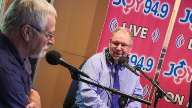 Neil Mitchell (left) and Robert Doyle help celebrate Joy's 21st anniversary. 