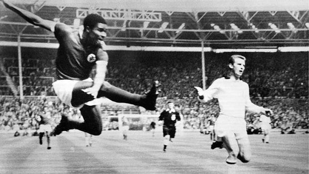 Soccer legend Eusebio da Silva Ferreira kicks for goal during an European Cup  match between Milan AC and Benfica at Wembley in 1963.