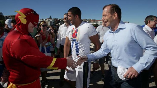 Tony Abbott meets The Flash at Bondi on Sunday.