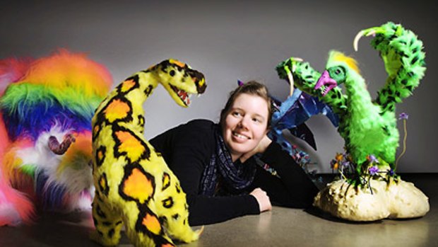 Artist Kate Rohde with her faux-fur dinosaur creations.