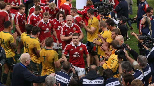 Strong start: Brian O'Driscoll leads the Lions off the field after their Test victory in Brisbane.
