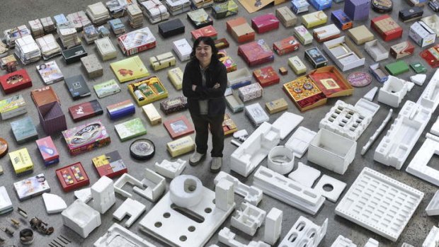 Artist Song Dong stands amid his art installation Waste Not at Carriageworks.