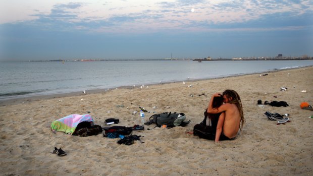 People tried to beat the heat by sleeping on St Kilda beach.