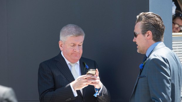 Communications minister Mitch Fifield and GRACosway partner Richard King in the Birdcage on Derby Day.