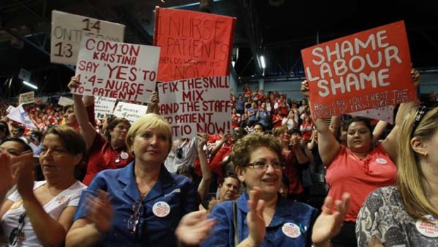 Striking nurses met at the Sydney Olympic Park Sports Centre in Homebush yesterday. Up to 190 public hospitals scaled back their services, with wards reduced to night duty staffing levels.