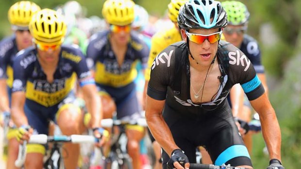 Leader of the pack: Richie Porte heads the peloton during the Tour de France, won by Sky teammate Chris Froome.