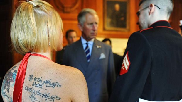 Life goes on ... Heather Nicely, left, stands with her husband, wounded US Marine Todd Nicely, as he greets Prince Charles at the British Embassy in Washington.