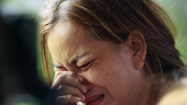 Distraught: The aunt of two children killed in a bomb blast in Bangkok.