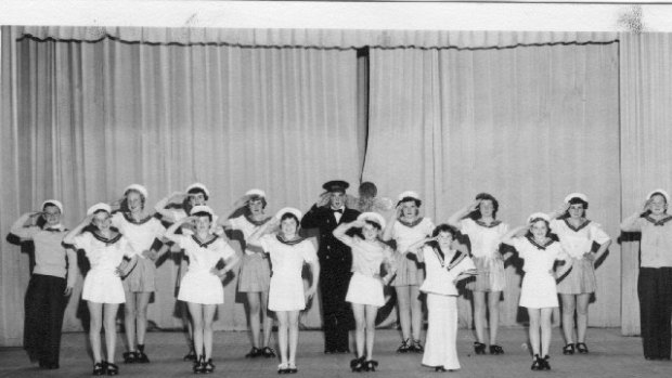 Claire Napier's dancing troupe performs <i>All the Nice Girls Love a Sailor</i> on the stage of  Cathedral Hall on Rusden Street, Armidale, about 1955. The song inspired Peter Allen's great song <i>I Could Have Been a Sailor</i>. He is on the left in the back row. His sister Lynne is wearing trousers in the front row.
