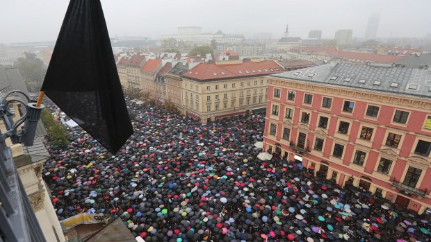 Thousands of women participate in the nationwide Black Monday strike to protest a legislative proposal for a total ban on abortion in Warsaw, Poland, in October last year. 
