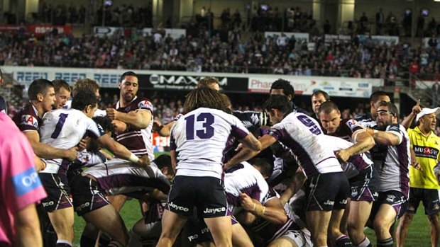 Players from Manly and Storm forget about the game and let each other have it.