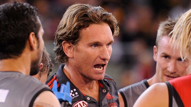 Essendon coach James Hird offers a word of advice to his team at quarter-time.