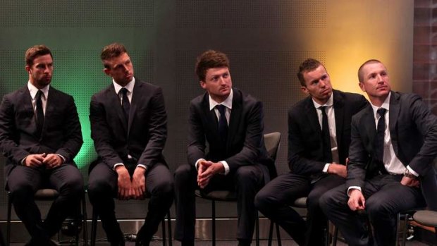 Australian cricketers from left Matthew Wade, James Pattinson, Jackson Bird, Peter Siddle and vice-captain Brad Haddin watch a video showing highlights of previous Ashes matches at the Cricket Australia announcement of the Ashes squad in Sydney.