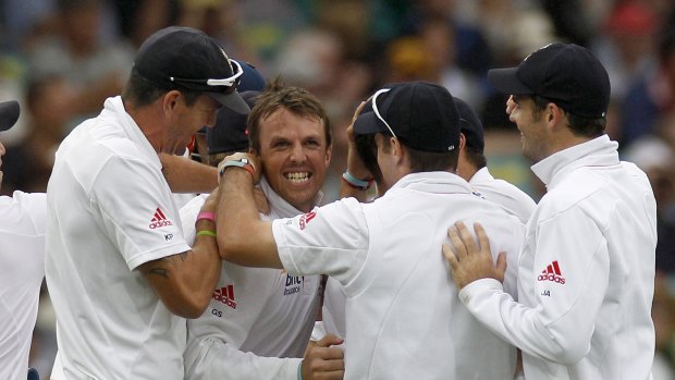 Happier times: Kevin Pietersen, far left, and Graeme Swann, centre, celebrate the wicket of Usman Khawaja during the 2011 Sydney Test.