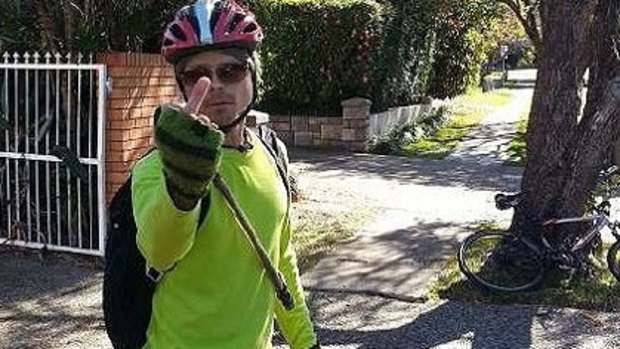 The bird-flipping cyclist allegedly abused a couple driving in Brisbane's west.